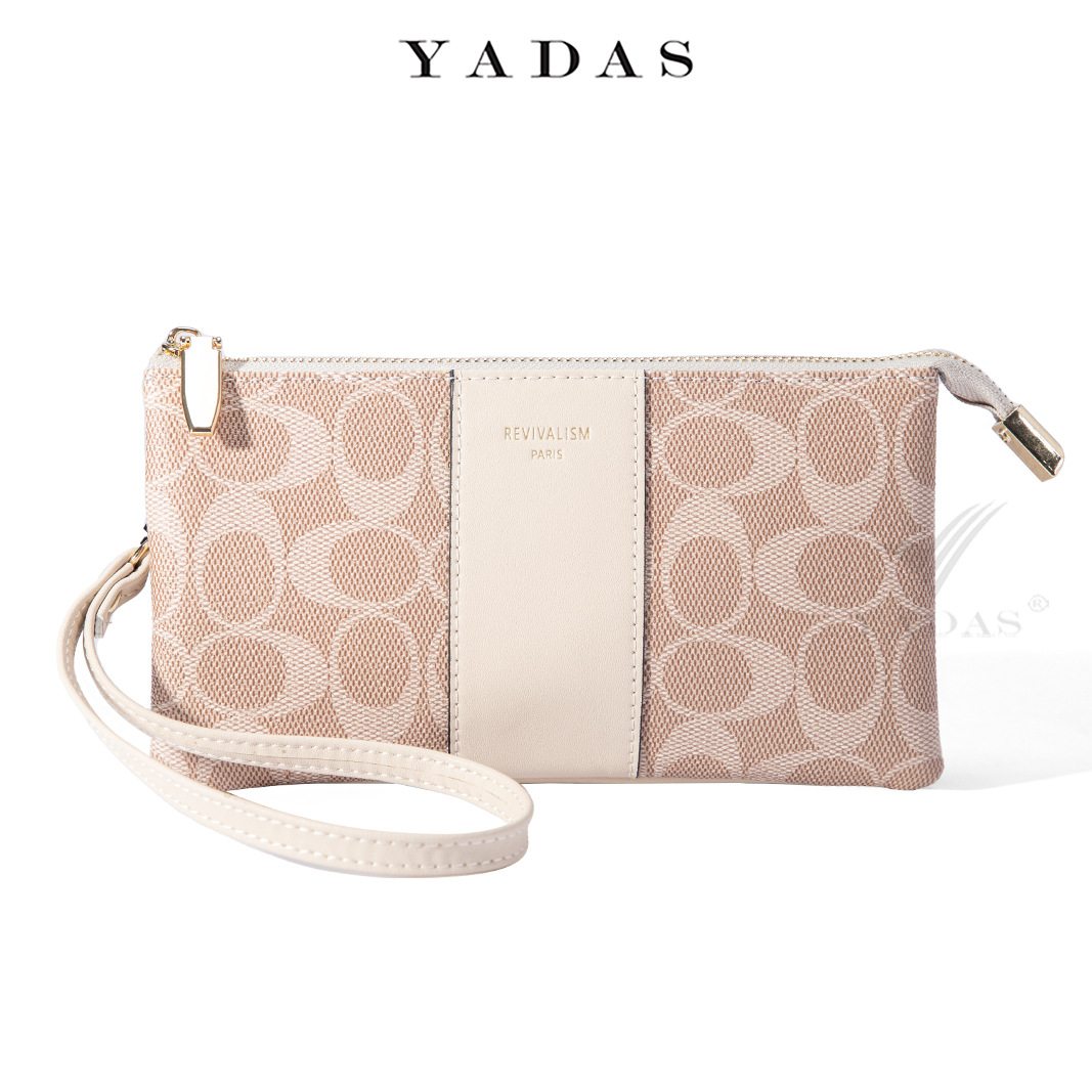 Ellipse monogram zip wristlet wallet in cream